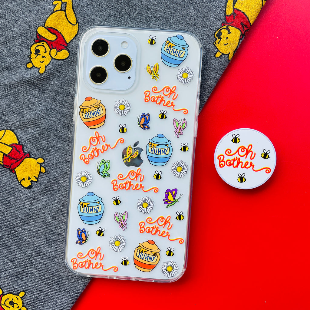 Oh Bother Winnie the Pooh Phone Case and matching Phone Pop on a red background