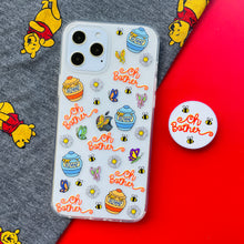 Load image into Gallery viewer, Oh Bother Winnie the Pooh Phone Case and matching Phone Pop on a red background